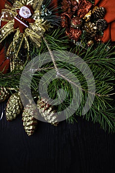 Christmas frame, Santa Claus, red scarf, wreath, bumps,on wooden background. Traditional rustic decor for new year holidays. Flat