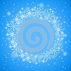 Christmas frame with snowflakes. Round frame on a blue background