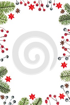 Christmas frame of tree branches, red berries and stars isolated on white background