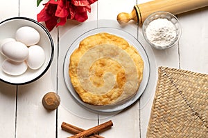 Christmas fritters with piloncillo and cinnamon on a white background. Mexican food photo