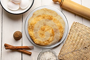 Christmas fritters with piloncillo and cinnamon on a white background. Mexican food photo