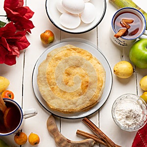 Christmas fritters with piloncillo and cinnamon on a white background. Mexican food photo