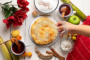 Christmas fritters with piloncillo and cinnamon on a white background. Mexican food photo