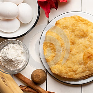 Christmas fritters with piloncillo and cinnamon on a white background. Mexican food photo