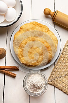 Christmas fritters with piloncillo and cinnamon on a white background. Mexican food photo