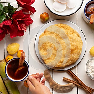 Christmas fritters with piloncillo and cinnamon on a white background. Mexican food photo