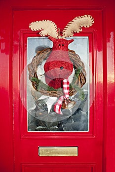 Christmas front door with handmade reindeer wreath