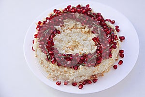 Christmas fruit cake, pudding on white plate. Traditional New Year dessert.