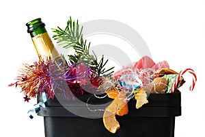 After christmas garbage dump food christmas tree branch empty bottle colorful tincel peel orange tangerine waste