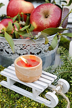 Christmas garden decoration with apples and lanterns