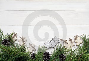 Christmas garland, Decoration, fir tree and sugar-glaze cookies on white wooden background. Top view, copy space