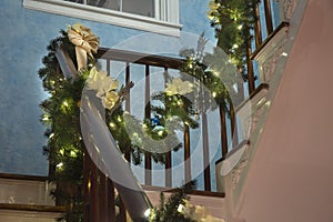 Christmas garland draped over bannister photo