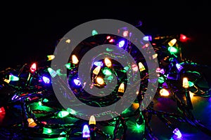 Christmas garland lights on darck background