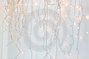 Christmas garland lights over grey background