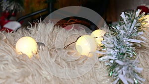 Christmas garland lights on a white carpet