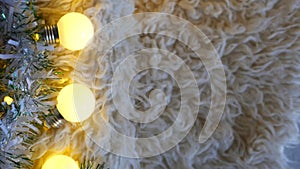 Christmas garland lights on a white carpet