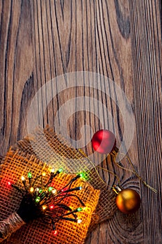 Christmas garlands of lamps on a wooden background