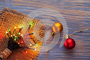 Christmas garlands of lamps on a wooden background