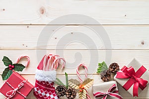 Christmas gift background with red box of present on white pine wood background for X`mas winter holiday backdrop and design