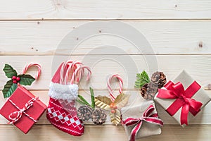 Christmas gift background with red box of present on white pine wood background for X`mas winter holiday backdrop and design