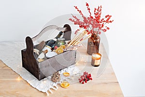 Christmas gift basket with food and decorations.