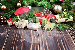 Christmas gift box. Christmas presents in boxes at black wooden table with copy space.