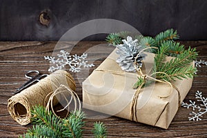 Christmas gift box. Christmas presents in handmade boxes on a wooden table