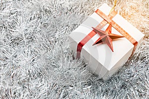 Christmas gift box and decoration on white fir background