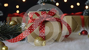 Christmas gift box and decorations with bokeh lights background