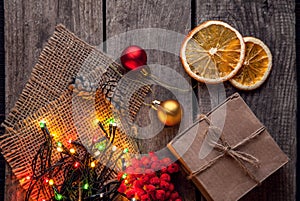 Christmas gift box and decorations on wooden background copy spa