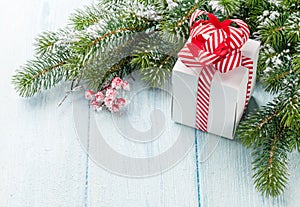 Christmas gift box and fir tree branch