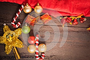 Christmas gift box, food decor and fir tree branch on wooden table.