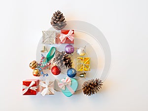 christmas gift box,golden glister ball and pine cone in tree shape.