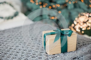 Christmas gift box with green ribbon