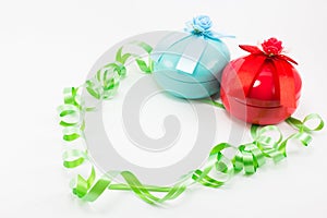 Christmas gift box with green ribbon on white background.