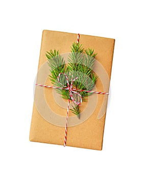 Christmas gift box isolated. New year or christmas present DIY box wrapped craft paper fir branch white background