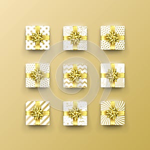 Christmas gift box present in golden ribbon bow and wrapping paper dotted pattern. Vector Christmas gold foil gift boxes set isola