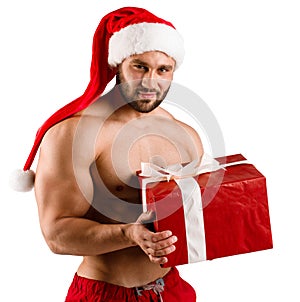 Christmas gift box from white torsed Santa Claus in red hat with muscular body, isolated