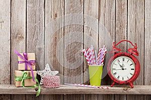 Christmas gift boxes, alarm clock and food decor photo