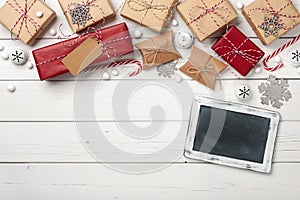 Christmas gift boxes background with chalk board