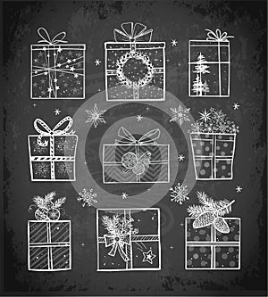 Christmas gift boxes on blackboard background. Doodle sketch vector illustration.