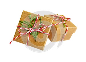 Christmas gift boxes isolated. Xmas New Year present box wrapped craft paper decorated green branch on white background