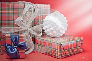 Christmas gift boxes at red background