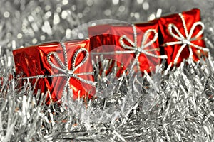 Red Christmas gift boxes and silver tinsel photo