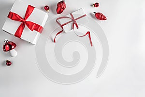 Christmas gift boxes with red ribbon and decoration on white background. Xmas and Happy New Year theme, snow