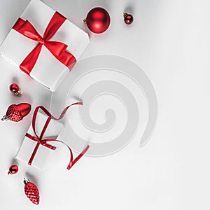 Christmas gift boxes with red ribbon and decoration on white background. Xmas and Happy New Year theme.