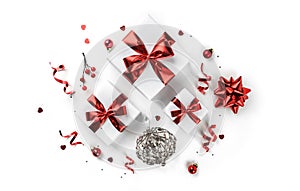 Christmas gift boxes with red ribbon and decoration on white background. Xmas and Happy New Year theme, snow. Flat lay