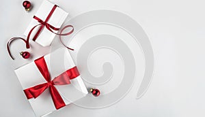 Christmas gift boxes with red ribbon and decoration on white paper background. Xmas and Happy New Year theme, bokeh