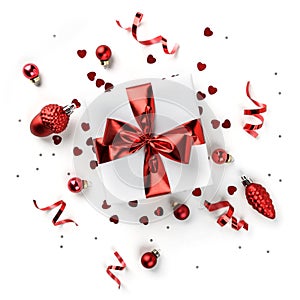 Christmas gift boxes with red ribbon, sparkles, confetti and decoration on white background. Xmas and Happy New Year holiday