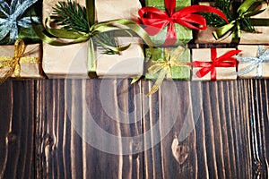 Christmas gift boxes on wooden table with copy space